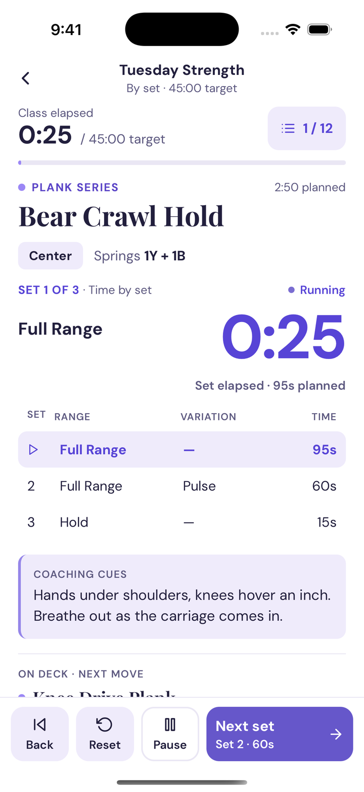 iPhone teaching view showing class and set elapsed timers, Bear Crawl Hold, springs 1Y + 1B, three timed sets, coaching cues, and Next set controls.